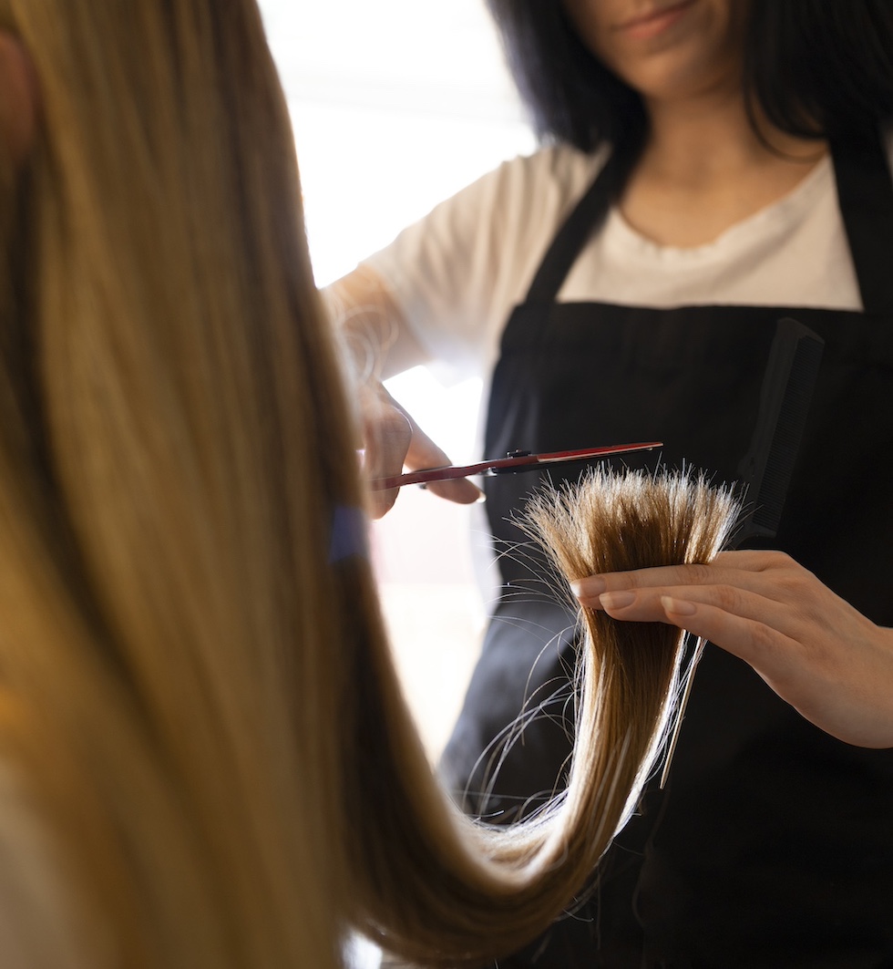skin-care-essentals-female-client-getting-her-hair-cut-hairdresser